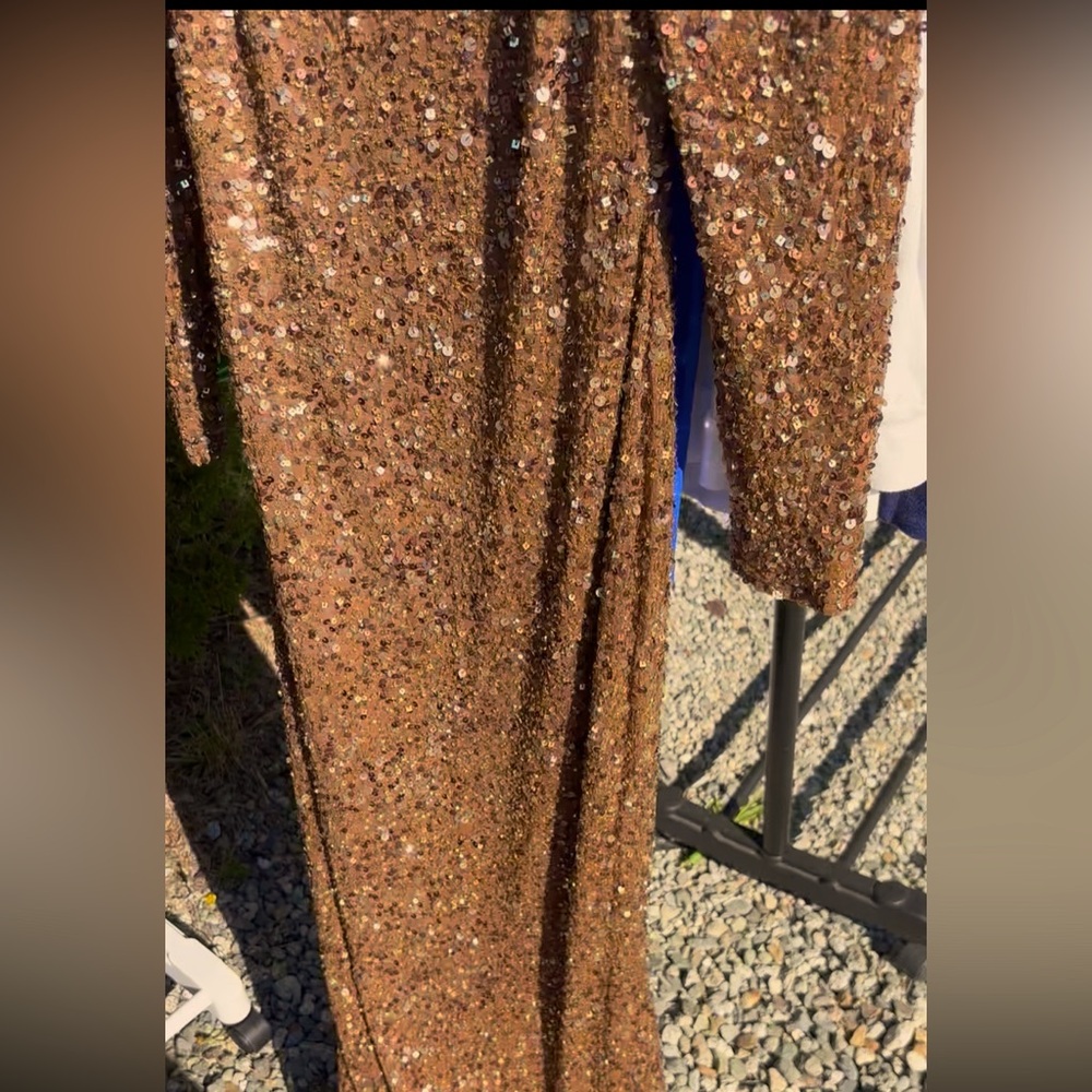 Gorgeous Blingy sequin open back gown. Never worn. $450 retail